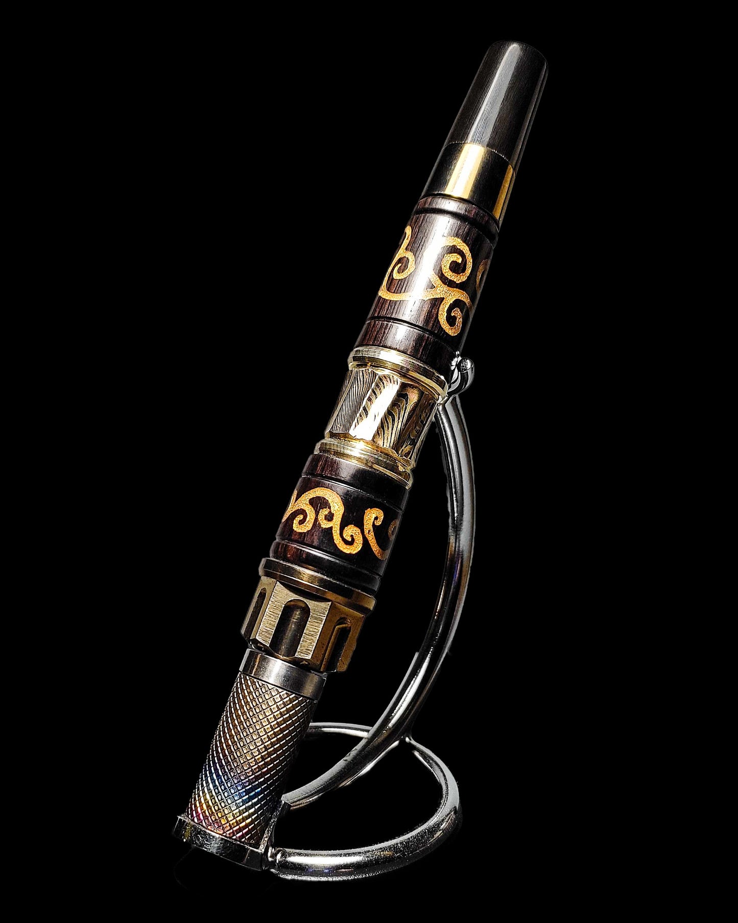 Photo of KGW Canvas, showing dark brown wood with gold inlays, golden metal crowns, and a wooden and golden mouthpiece