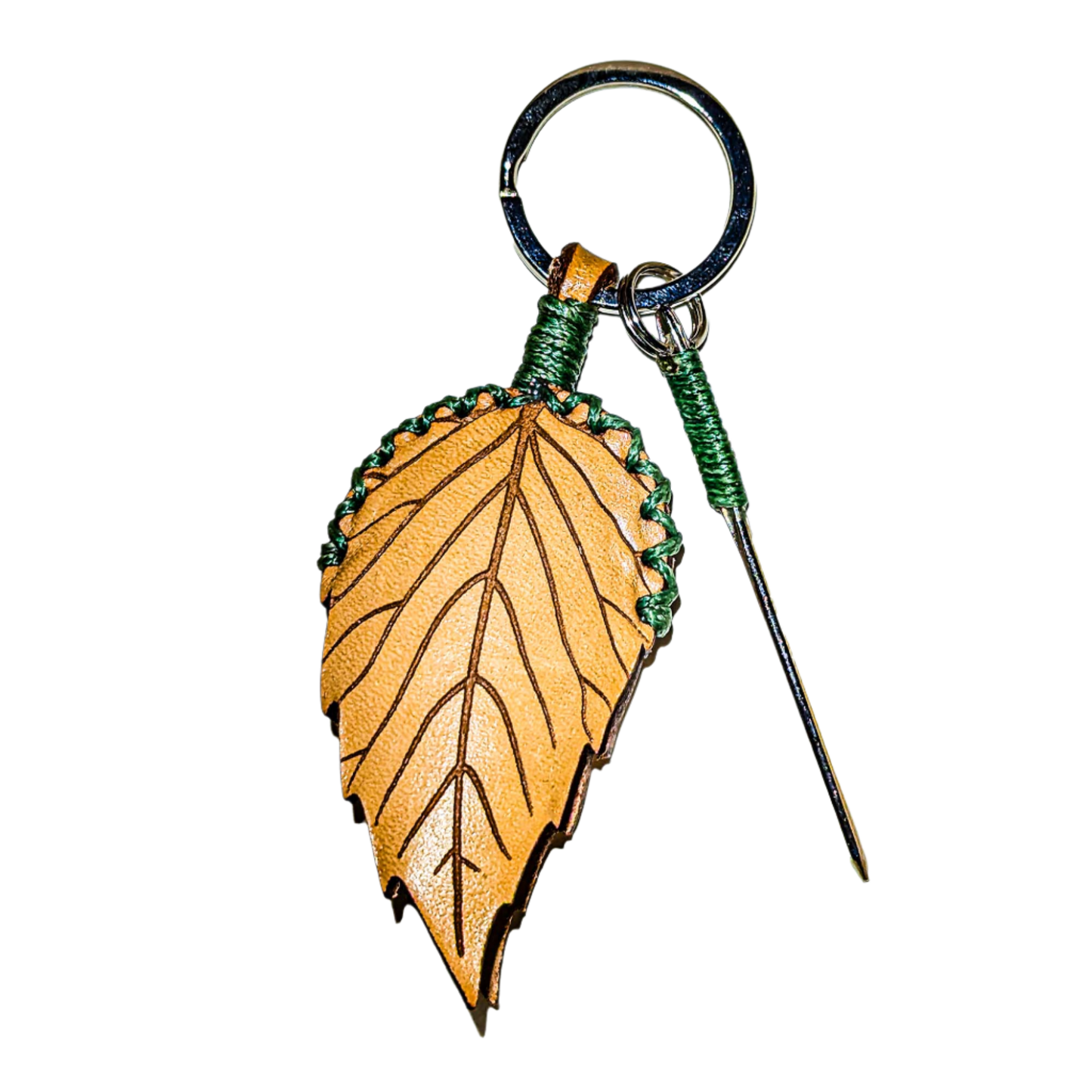 Front shot of forest decapper in natural leather with a leaf shape and green thread